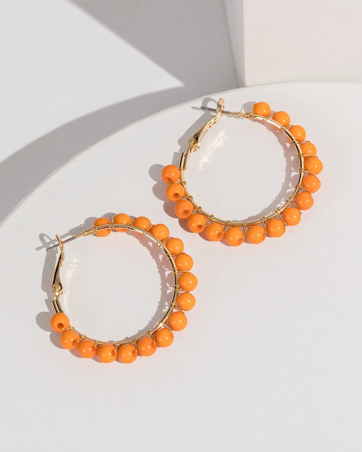 Colette by Colette Hayman Orange Beaded Wrapped Hoop Earrings